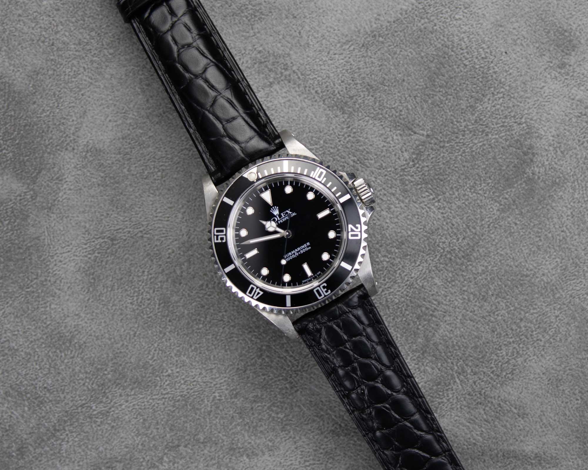 Rolex Submariner on a black alligator leather watch band