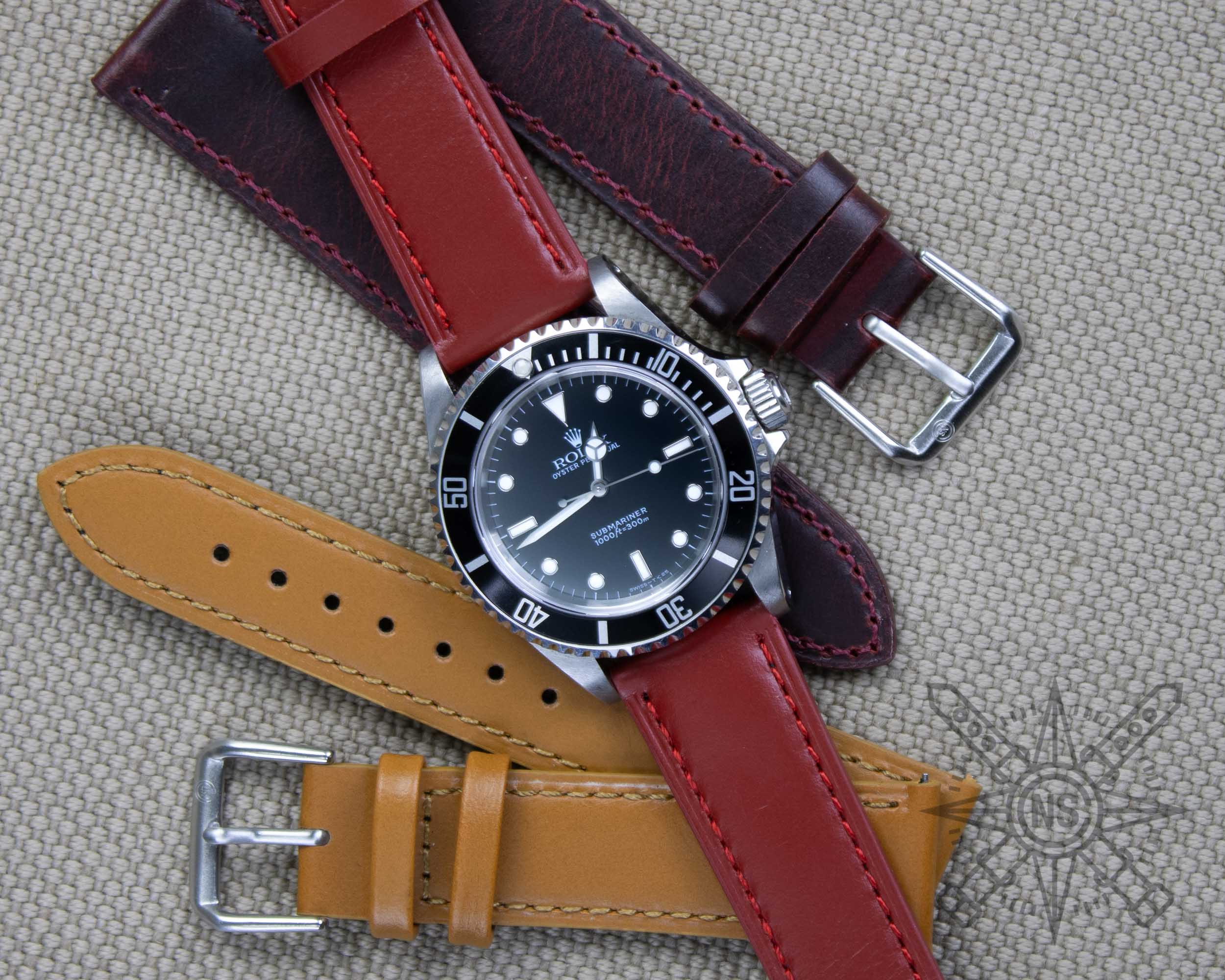 Oxblood red leather watch band on a Rolex Submariner