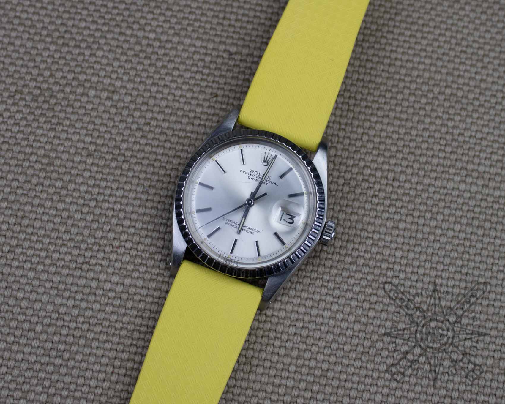 Rolex Datejust on a yellow rubber watch strap