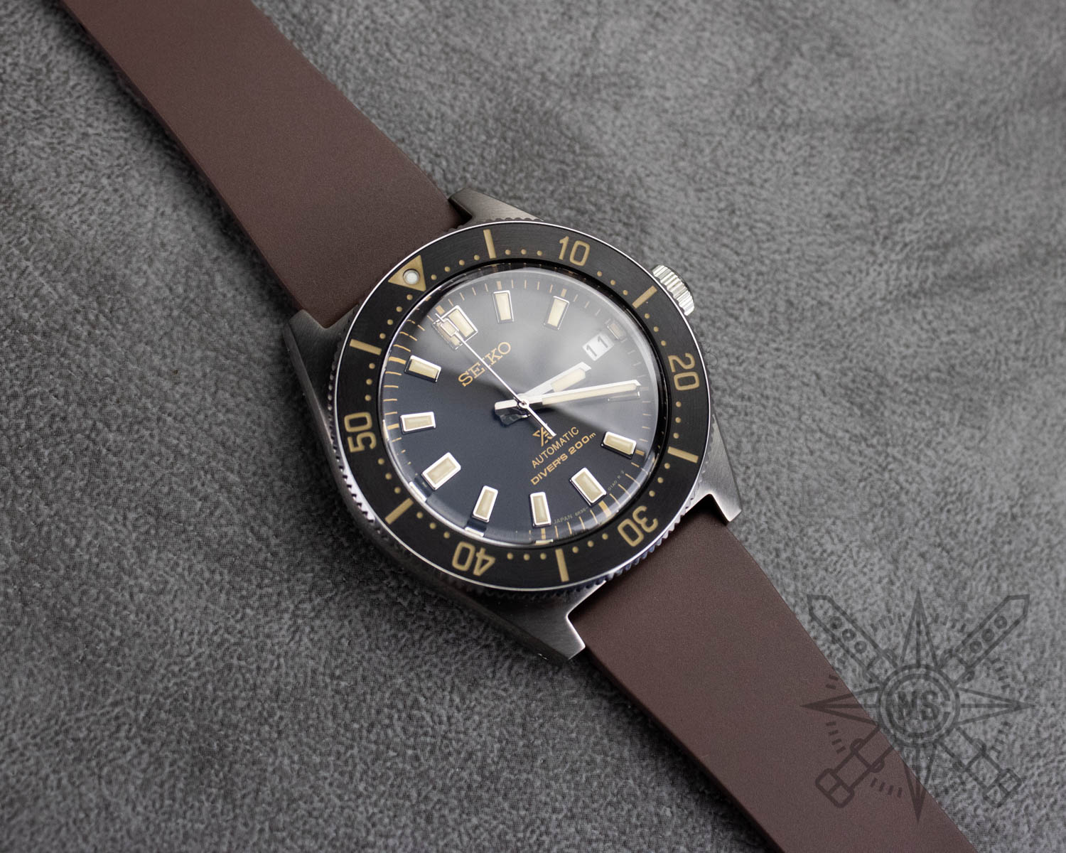 Brown rubber watch strap on a Seiko dive watch
