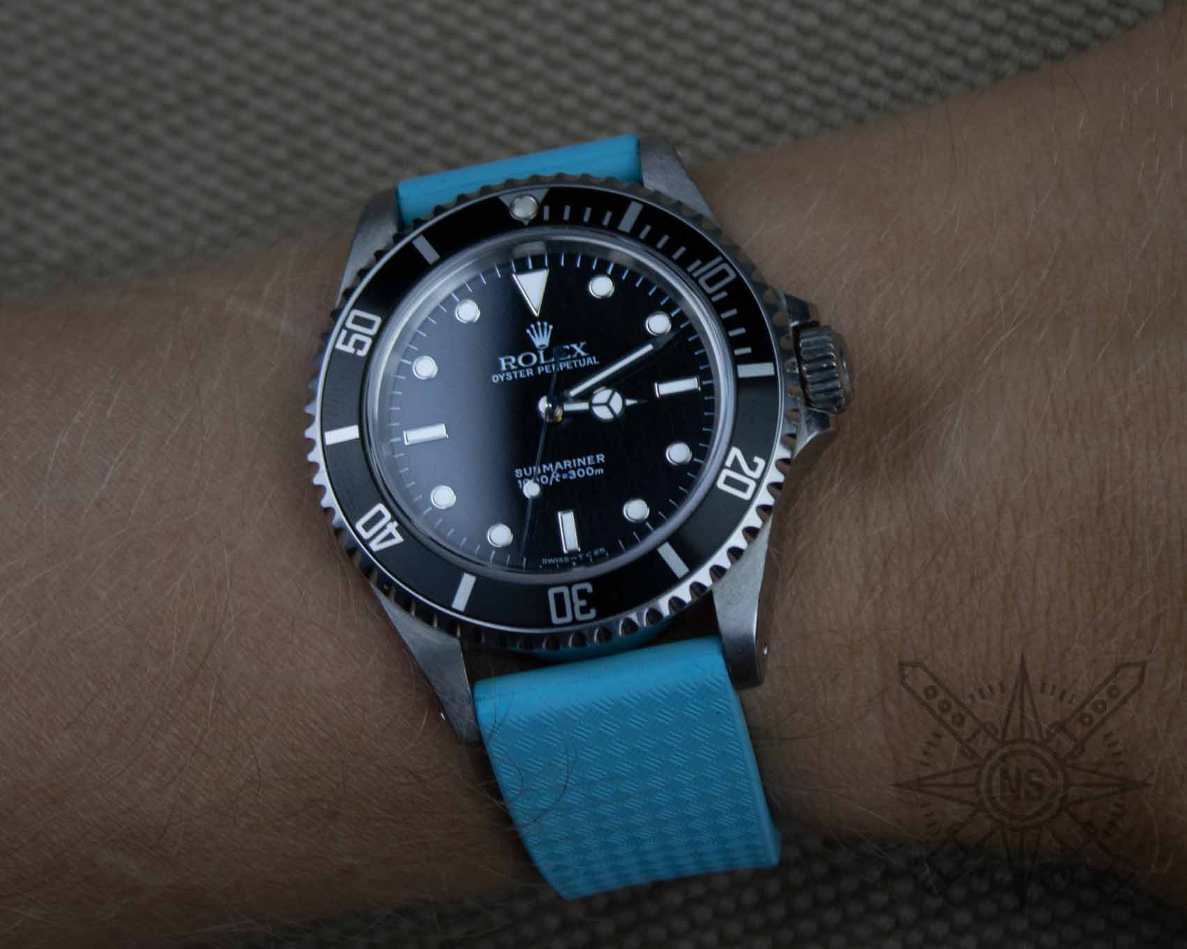 Blue rubber watch strap on Rolex Submariner