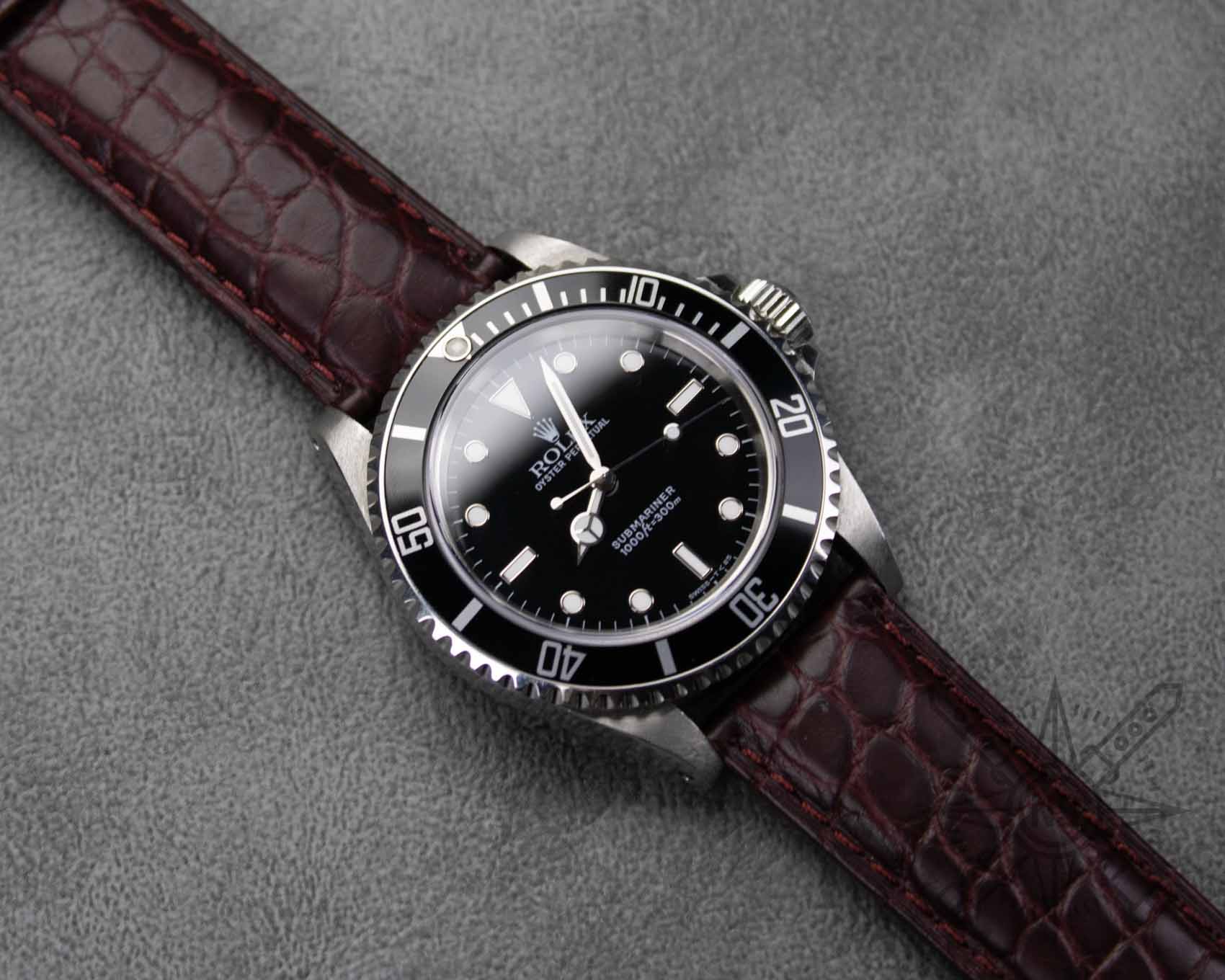 Burgundy red alligator watch strap on a Rolex Submariner