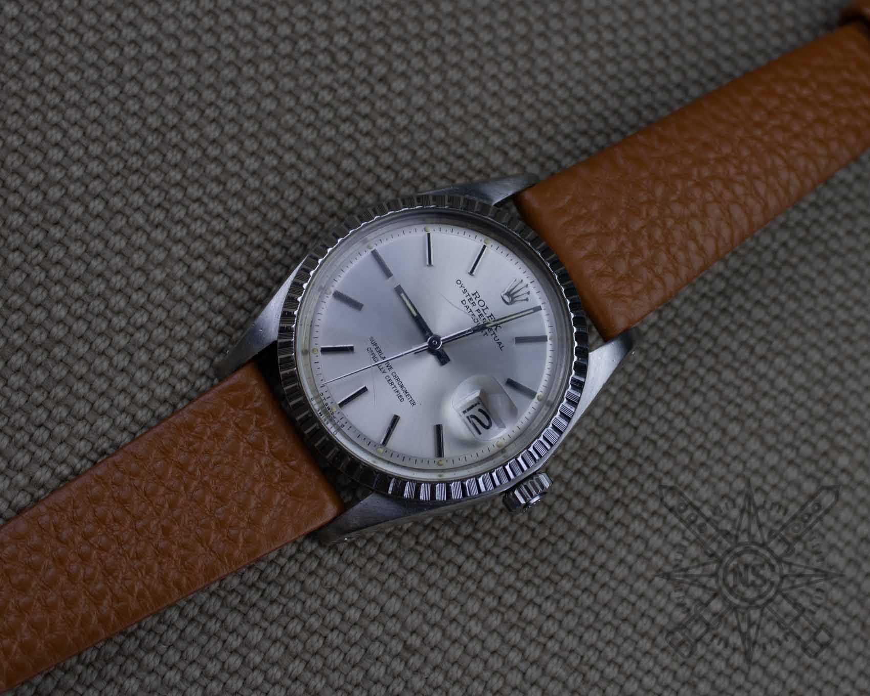 Rolex Datejust on a brown leather watch band