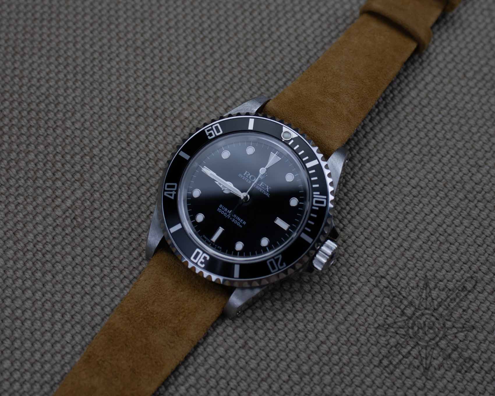 Rolex Submariner on a brown suede watch band