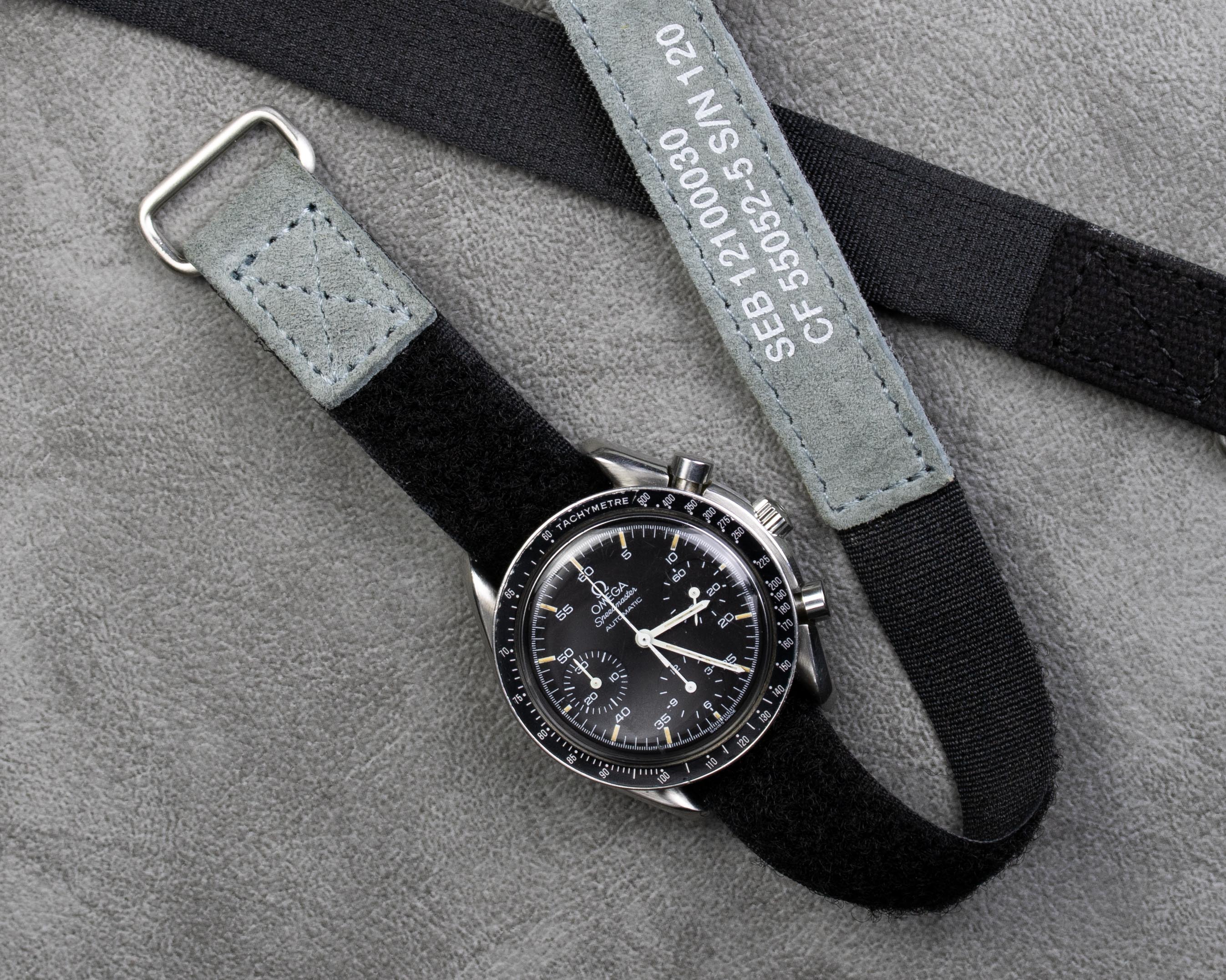 Gray suede NASA velcro watch strap on a Omega Speedmaster