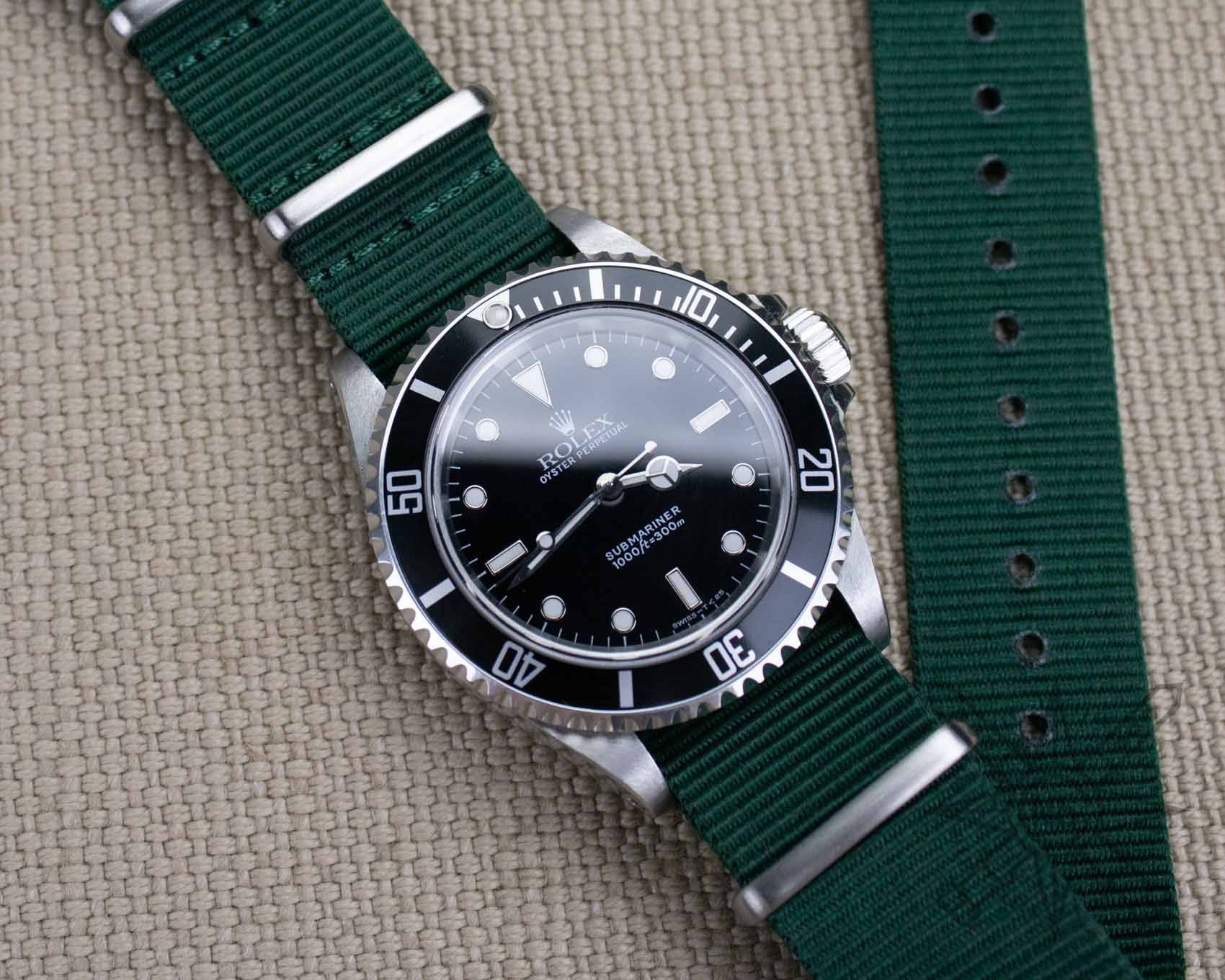 Green nylon watch strap on a Rolex Submariner