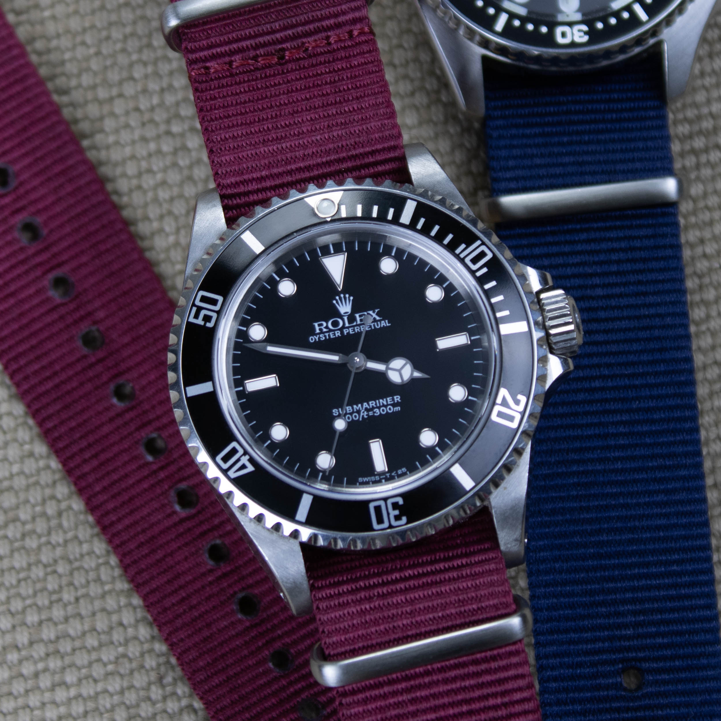 Burgundy red original nylon watch strap on a Rolex Submariner