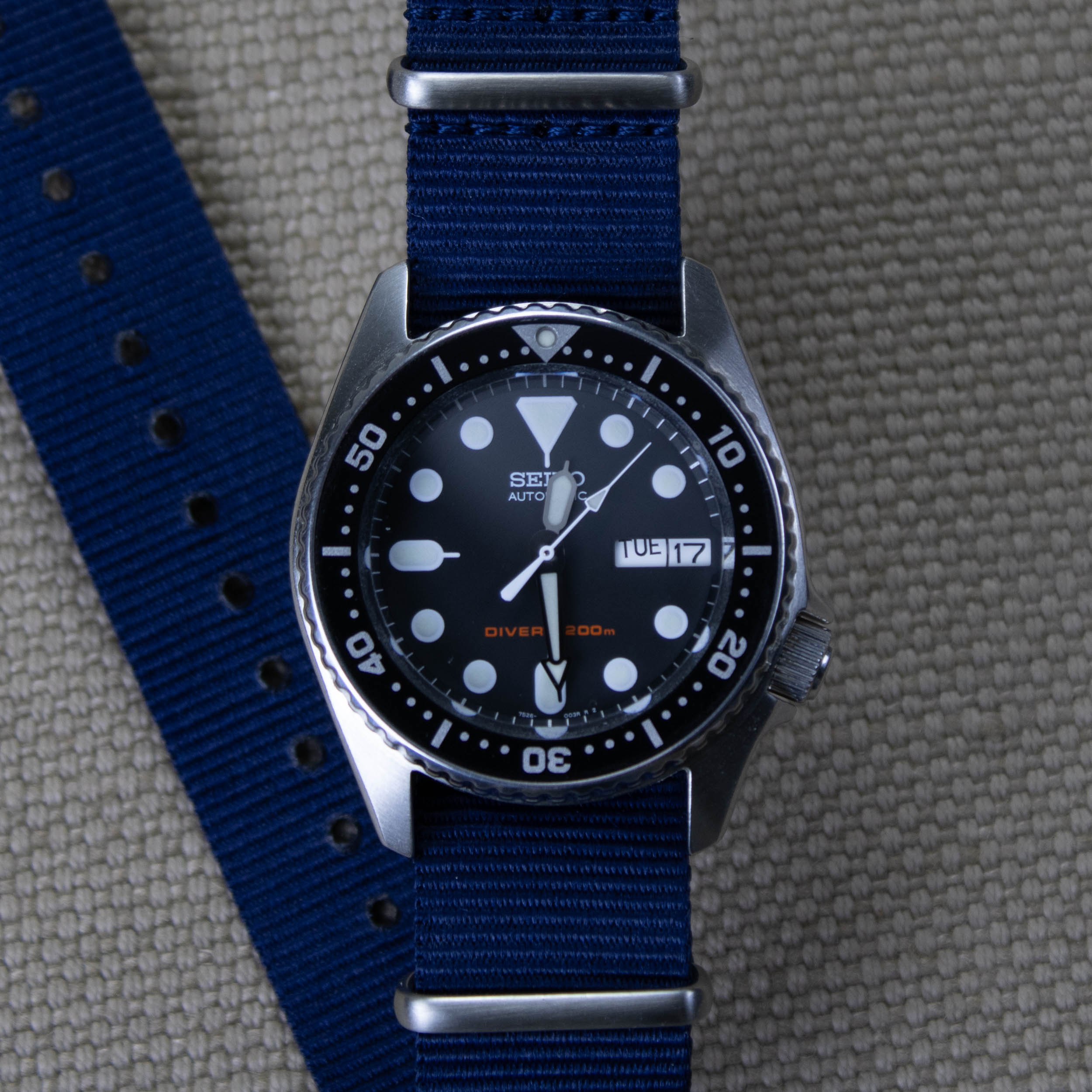 Seiko dive watch on a original nylon navy blue watch strap