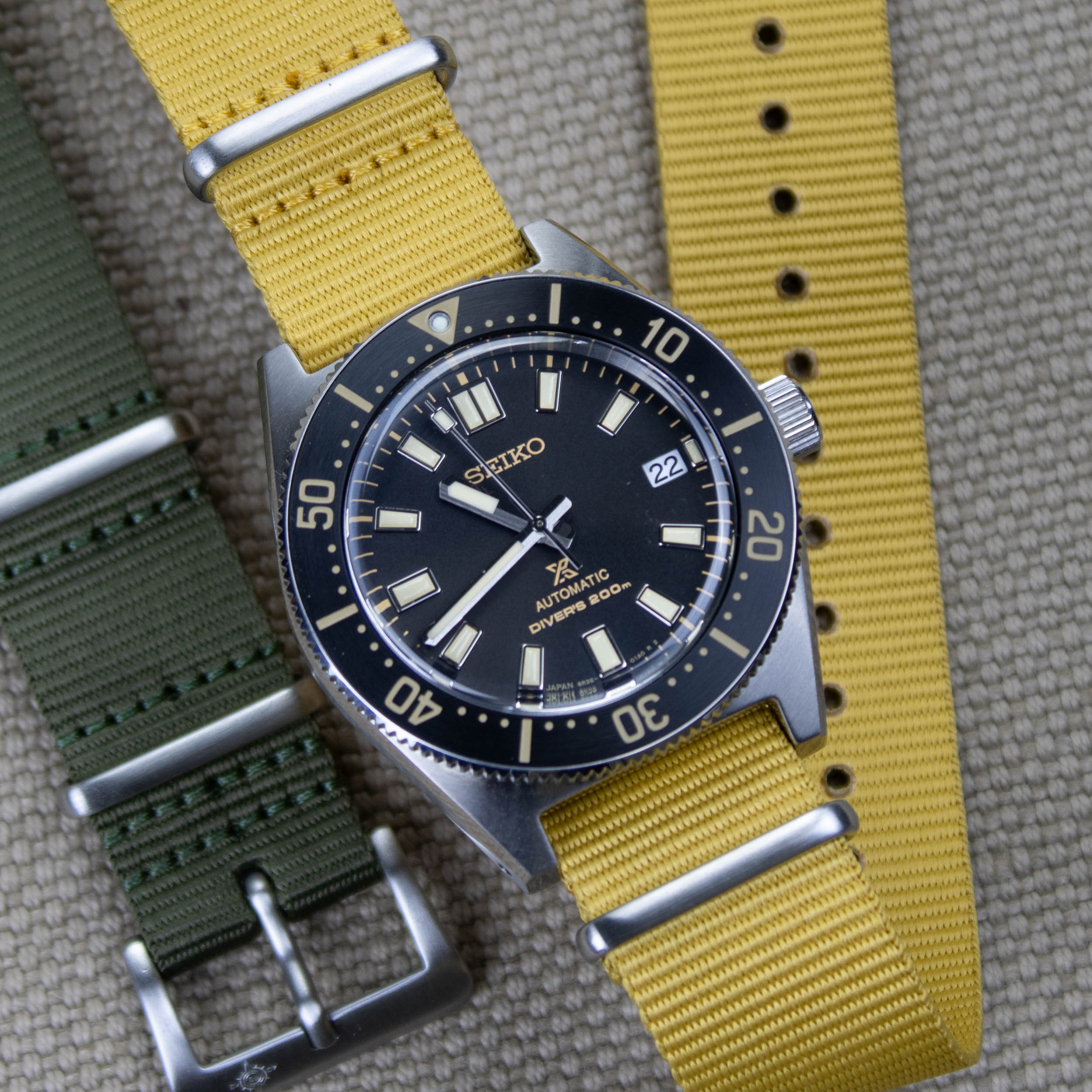 Mustard yellow nylon strap on a seiko dive watch