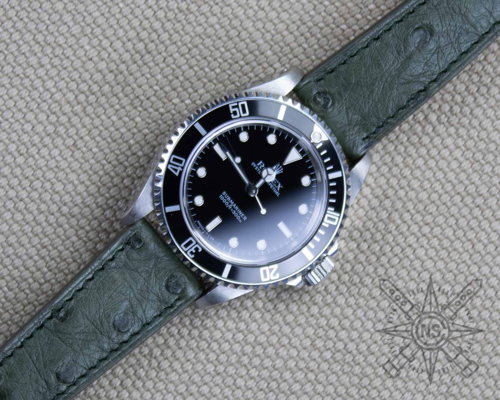 Green ostrich watch strap on a Rolex Submariner