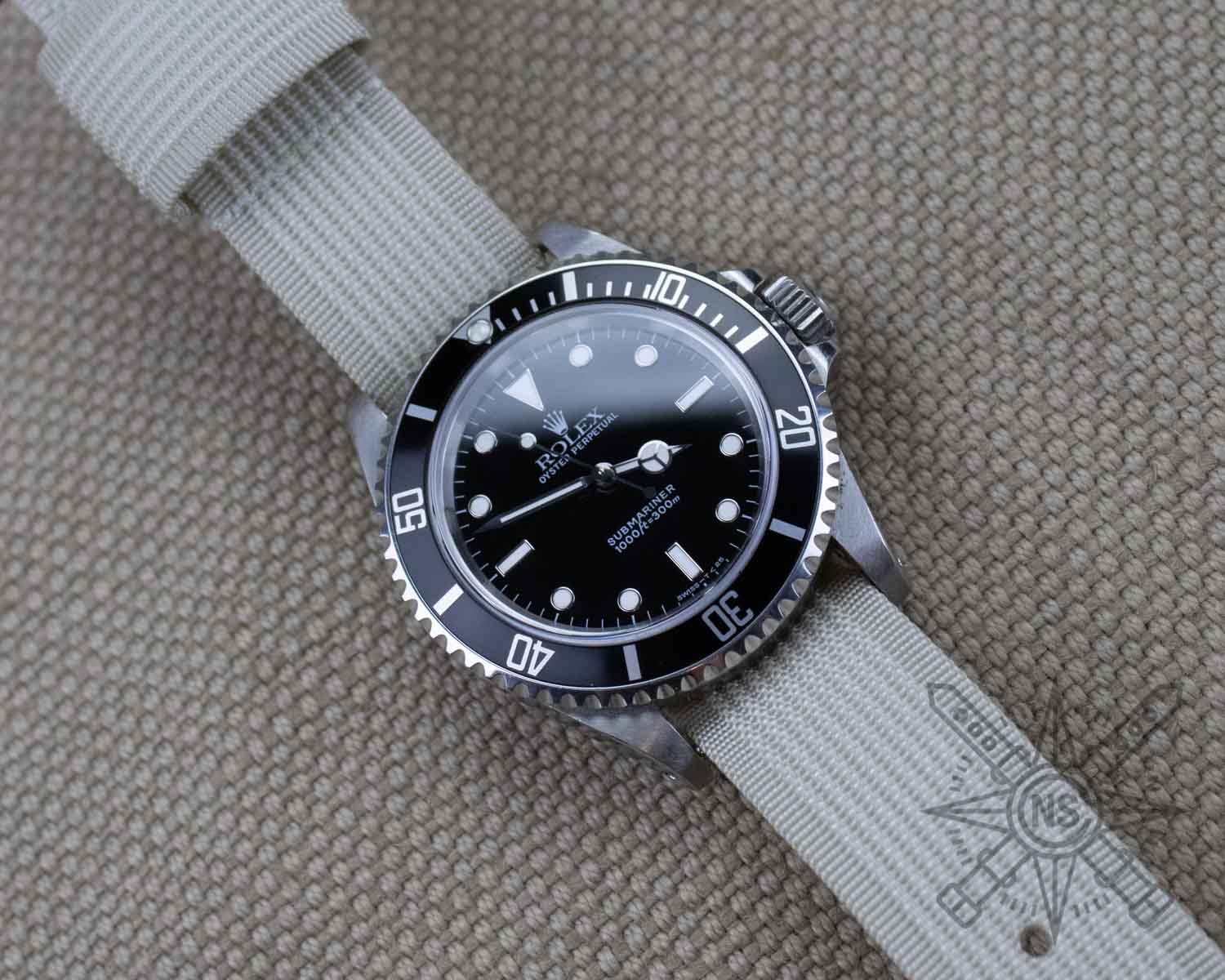 Off-white nylon watch strap on a Rolex Submariner
