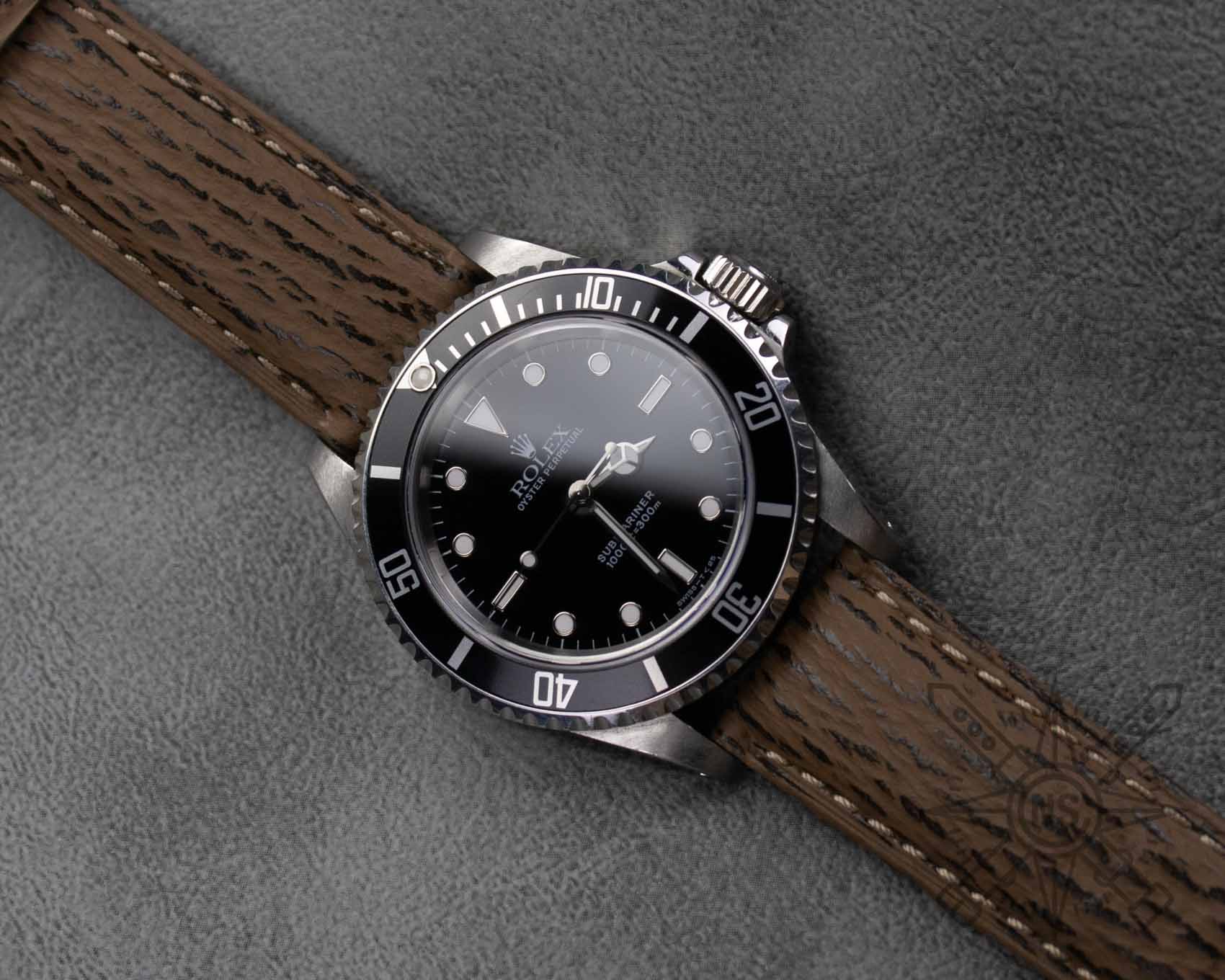Rolex Submariner on a brown shark watch band