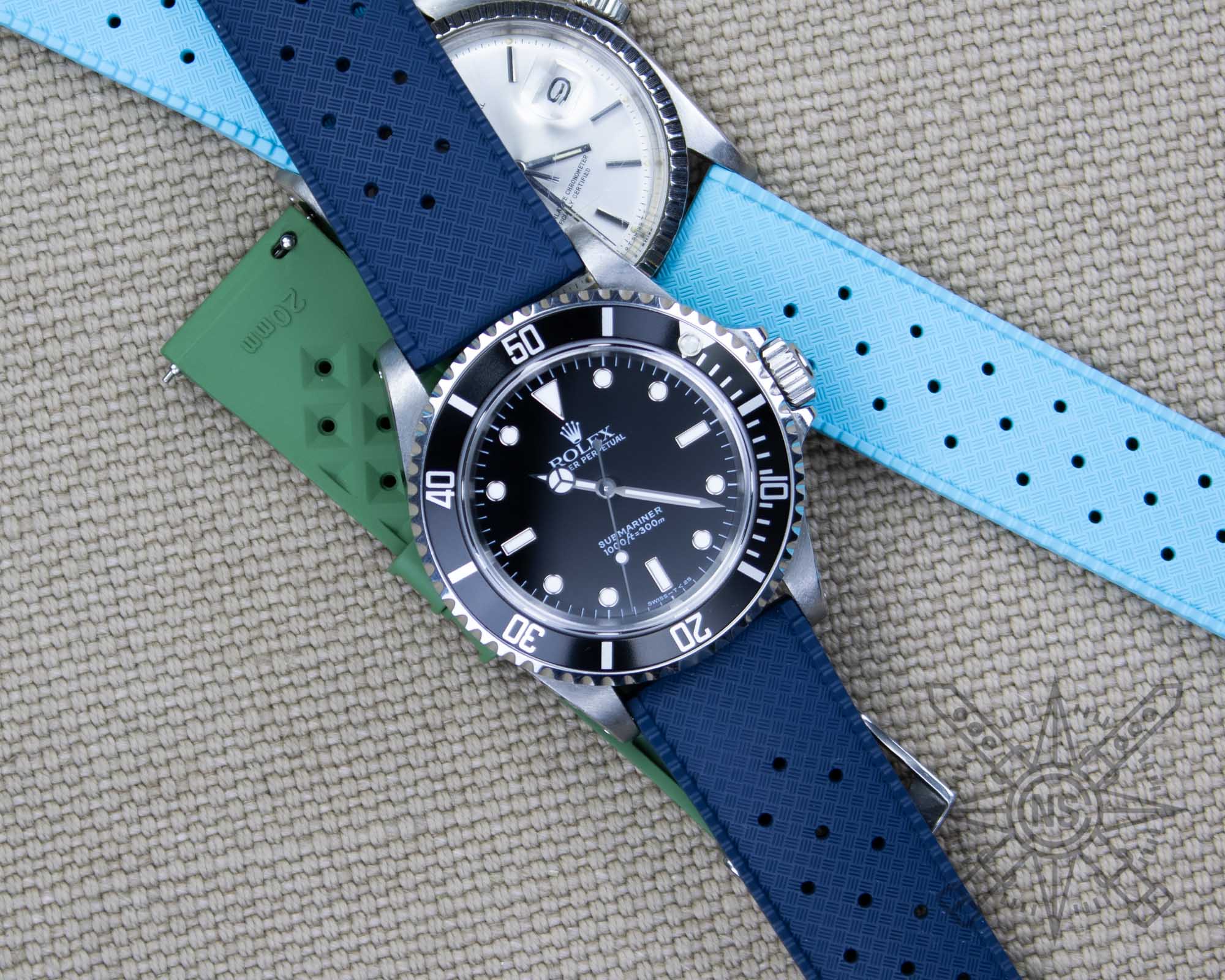 Rolex Submariner paired with a navy blue tropic rubber watch strap