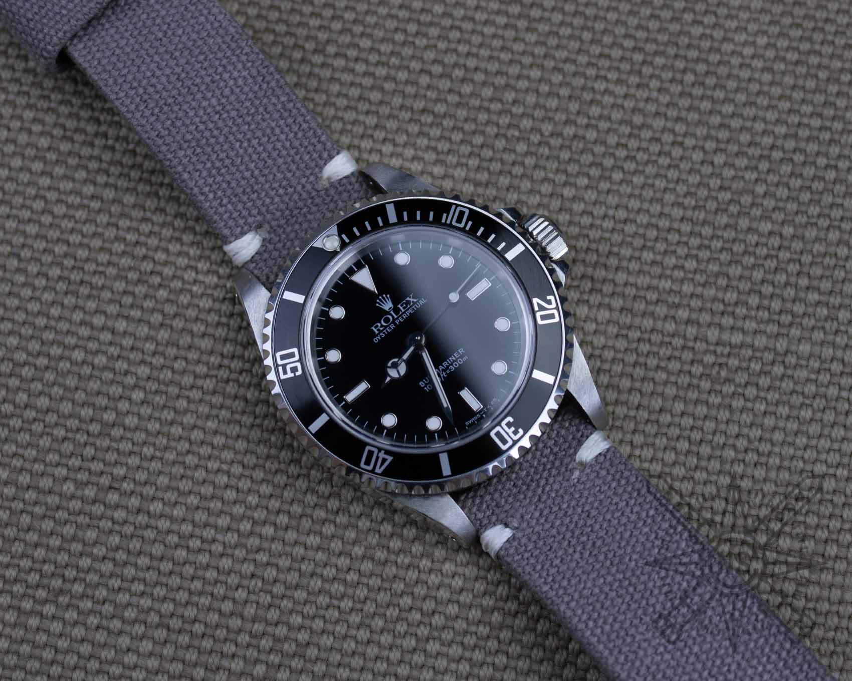 Rolex Submariner on a gray canvas watch strap