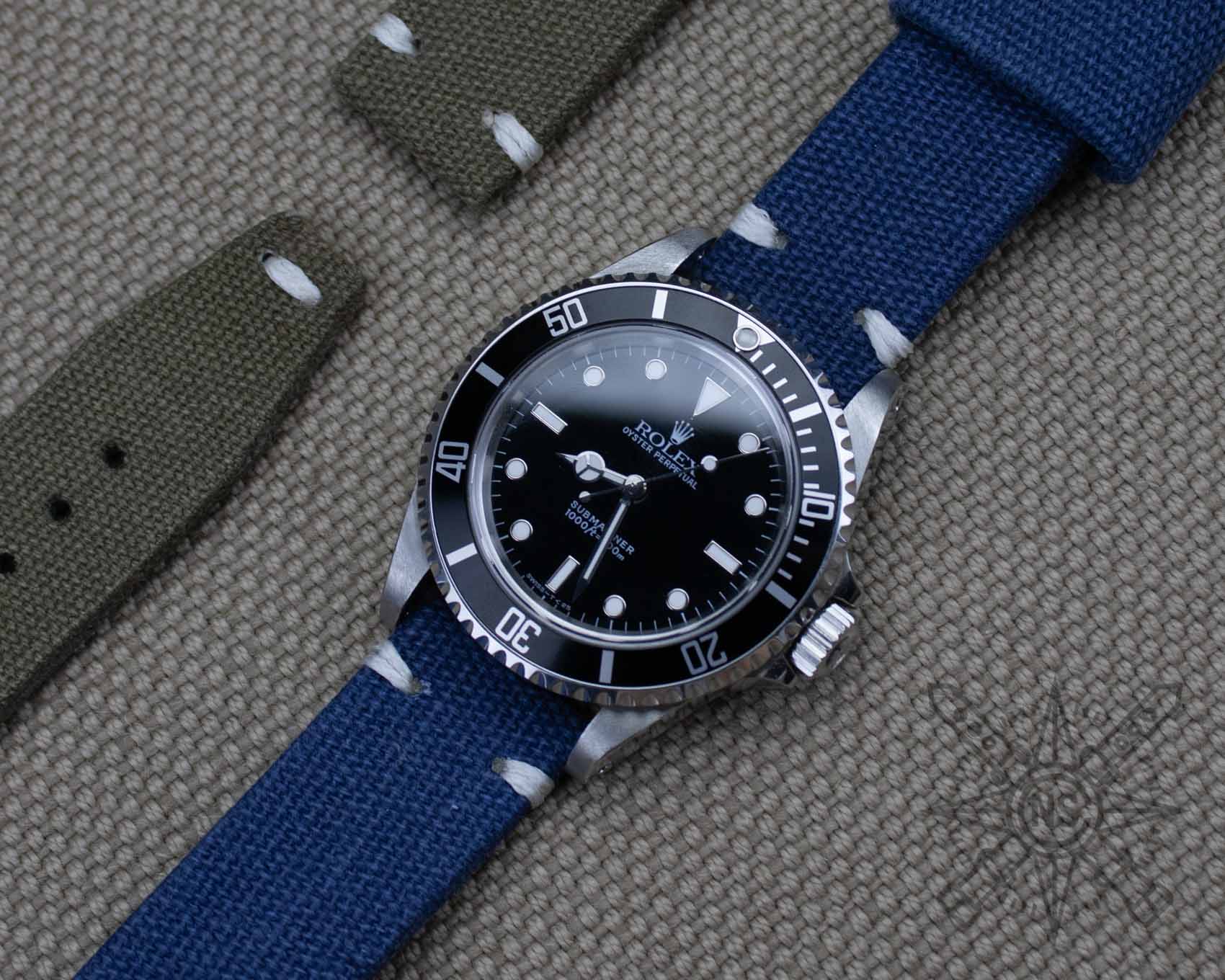 Rolex submariner on a blue watch strap