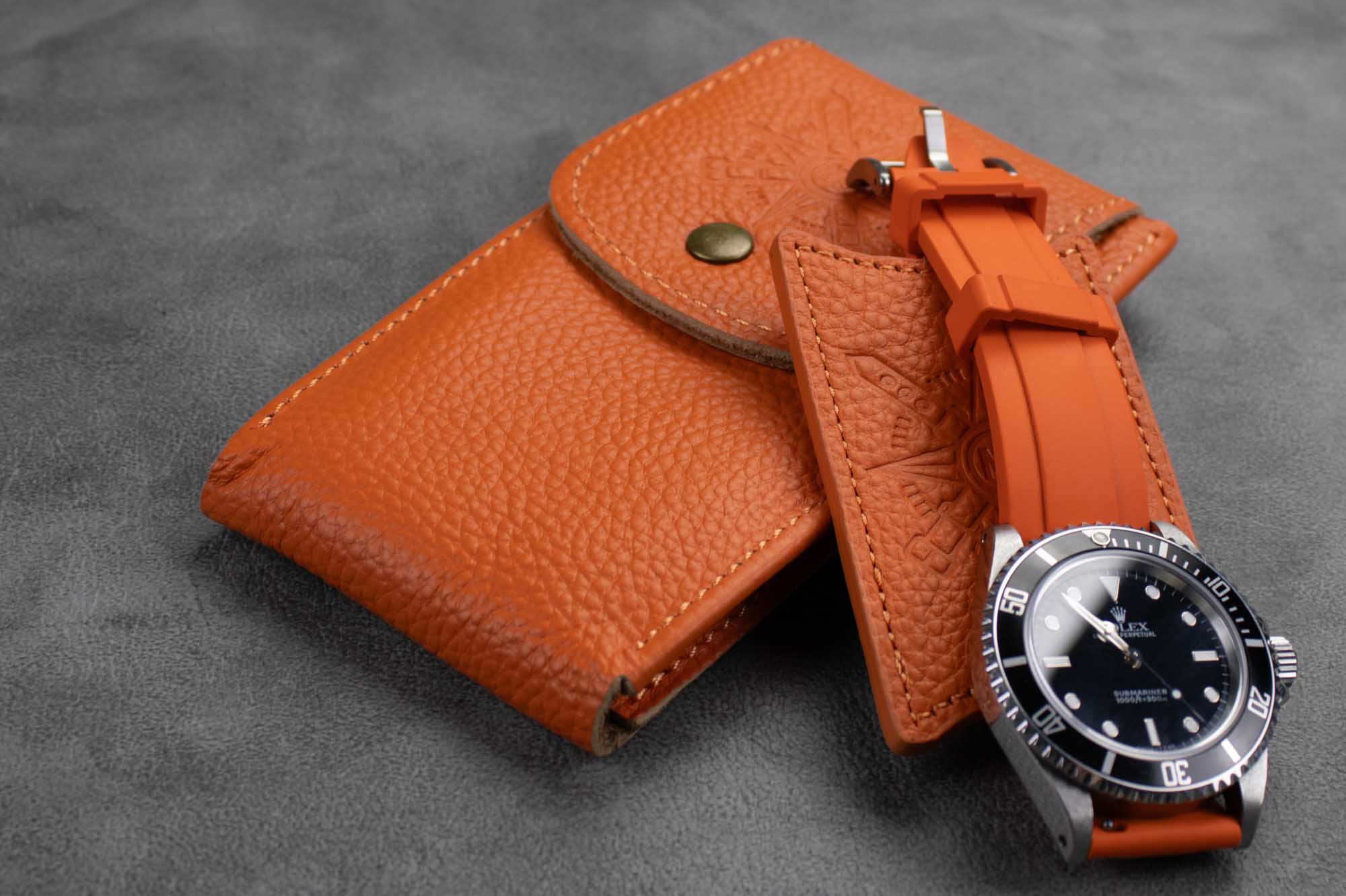 Orange leather watch pouch
